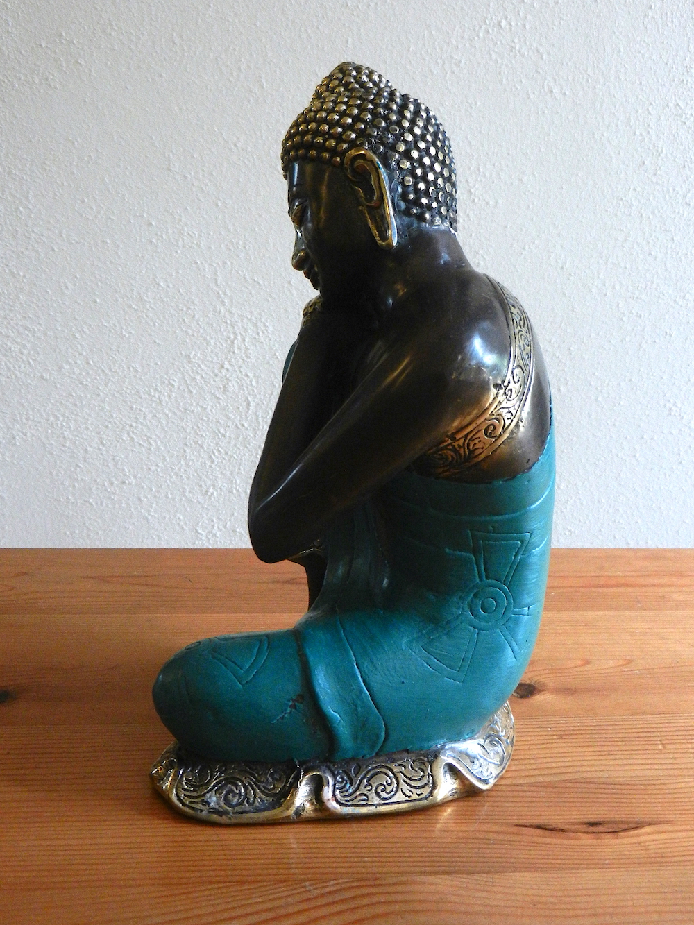 relaxing Buddha in green robe