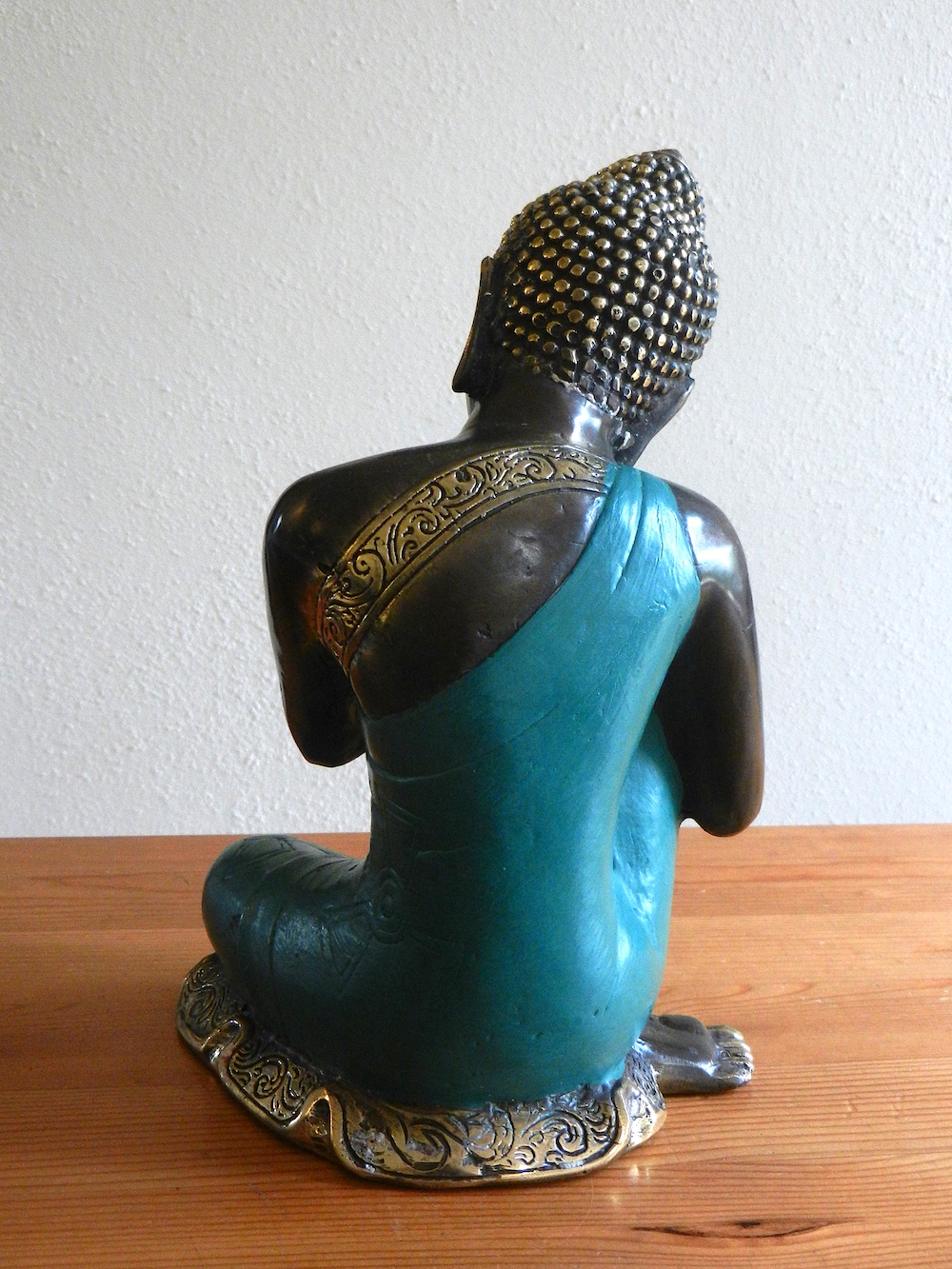 relaxing Buddha in green robe