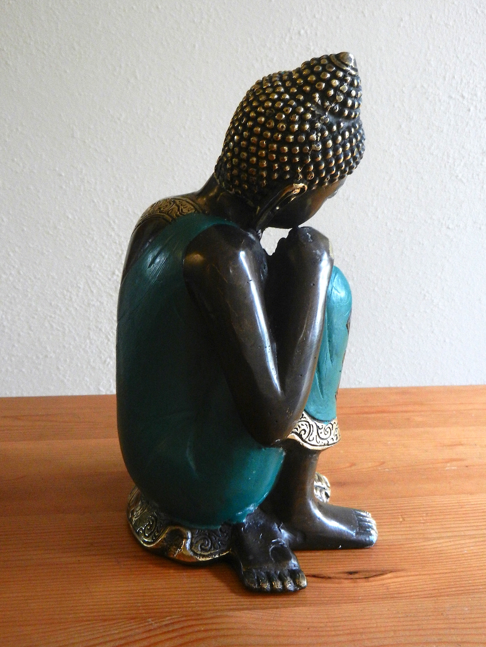 relaxing Buddha in green robe