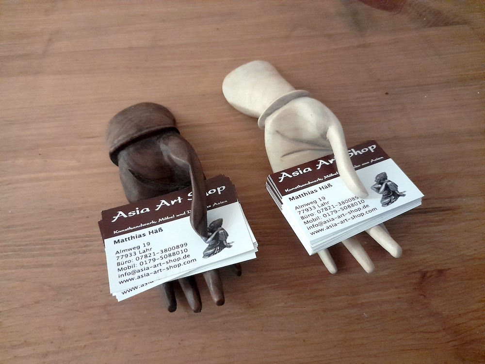 carved wooden hands